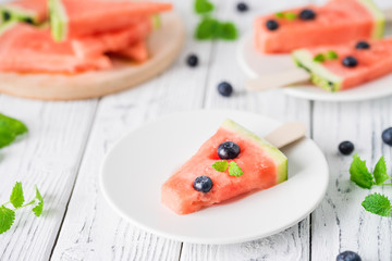 Watermelon popsicles with bluberry. Sweet snack concept. Selective focus