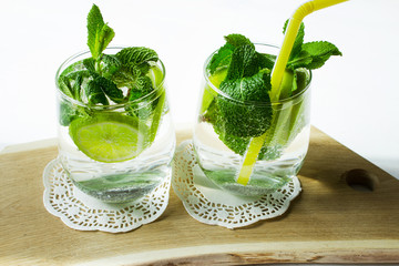 Non-alcoholic cocktail mojito on a wooden board. Selective focus. Horizontal.