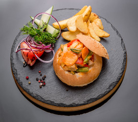 Vegetables and meat baked bun with ham, cheese  herbs.