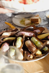 Plate with eclairs on the picnic table