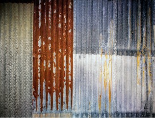 Old and rusty corrugated galvanized iron plate