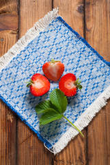 Fresh strawberries on old wooden background,