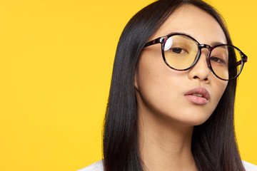 Woman in glasses, woman background, woman on yellow background portrait