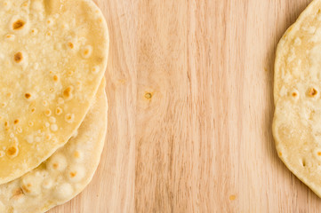 Flat Bread on a Wooden Background