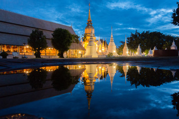 Pagodas reflecting in water, Wat Suan Dok oldest temple in Chiang Mai ,Thailand.