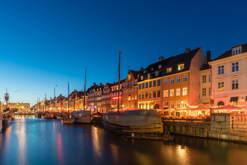 Scenic evening of  Nyhavn pier architecture in the Old Town of Copenhagen, Denmark.
