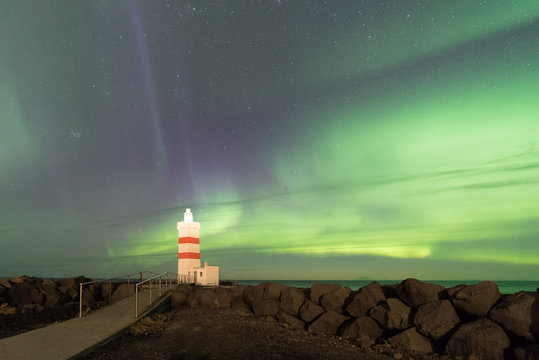 Aurora Borealis over the lighthouse in Iceland.