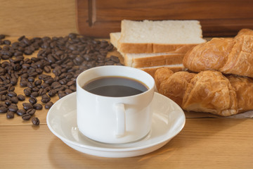 coffee and bread in the morning on food table
