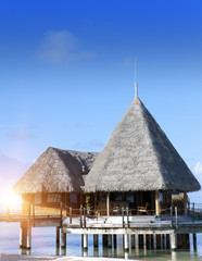 small houses on water in the ocean