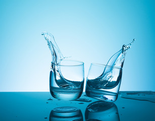 Creative splashing water in the glass