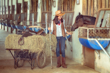 Cowgirls working at a horse farm,Sakonnakhon,Thailand.