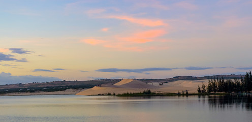Scenic sunset on a lake among the sands in Vietnam