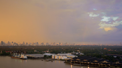 Obraz premium Beautiful lightnings and rainbow in the evening after heavy raining , Bangkok , Thailand