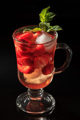 Carbonated lemonade with strawberry slices and mint