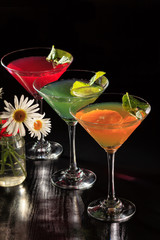 Kiwi, orange and cherry jelly with lime pieces in the glasses topped mint leaves