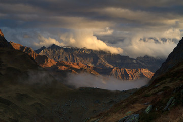 Colorful sunset over mountains and lake