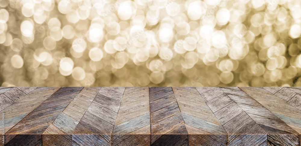 Poster empty old rustic wood table top with blur sparkling gold bokeh abstract background,panoramic banner 
