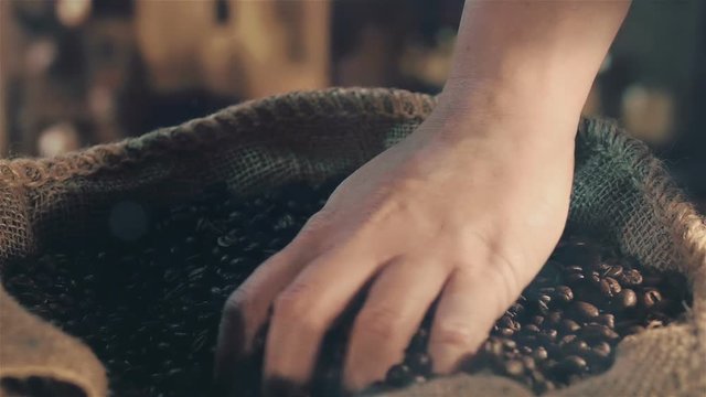 High quality video of taking coffee beans in real 1080p slow motion 250fps