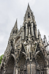 Fototapeta premium Saint-Ouen Abbey Church (Abbatiale Saint-Ouen, 1318 - 1537) is a large Gothic Roman Catholic church in Rouen, Normandy, France. Western facade with two spire-towers.