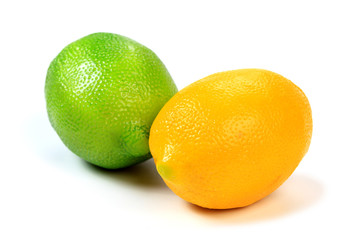 Closeup shot of green and yellow lemons isolated on white background