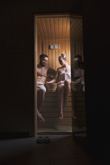 Couple enjoying sauna session