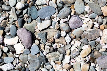 Assorted colors of natural rocks and pebbles for graphic background