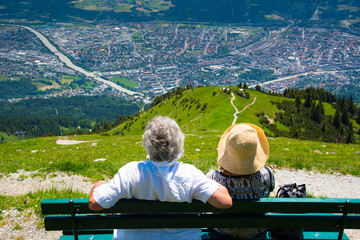Europe couples relaxing and looking to Innsbruck city from Seegrube mountain in sunny day