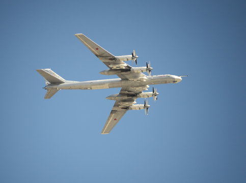 The group of Soviet strategic bomber Tupolev Tu-95 "Bear" flies over Red Square. Dress rehearsal of the Victory Day parade on Red Square.