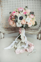 Wedding accessories: boutonniere and bride's bouquet