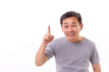 Fototapeta premium happy, confident middle aged old man pointing up, studio isolated