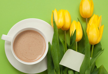 Coffee and yellow tulips with card