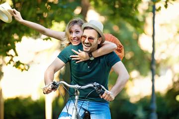 Happy Couple Riding a Bike