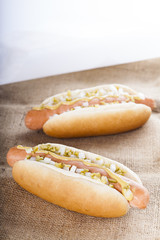 Hot dog grill with mustard, onion and pickles