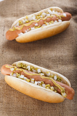 Hot dog grill with mustard, onion and pickles