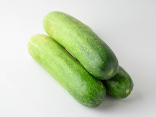 pile of cucumbers on white background