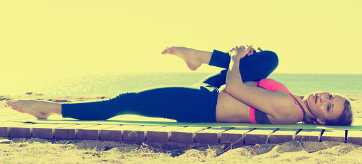 Healthy woman stretching muscles and body