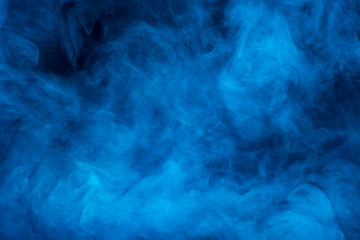 Texture of blue smoke on a black background