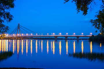 Bridge across the wide river Dnieper at night. Ukraine, Kiev.