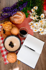 bread and coffee,flowers on the table in the morning