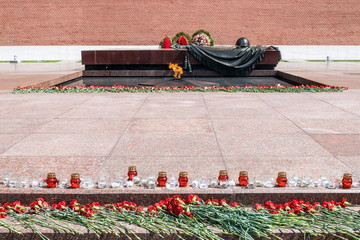 MOSCOW, RUSSIA - JUNE 20, 2017: Carnation flowers and candles at The Unknown Soldier Memorial in...