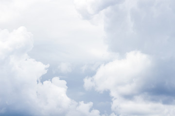Fluffy white clouds close-up as background.