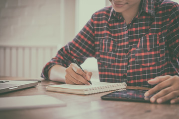 A business woman working on the laptop at the office, Looking for direction and inspiration, Office desk table with computer, supplies, Copy space for text