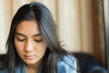 Beautiful young Asian woman in the cafe