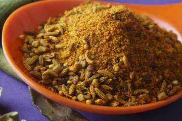 close up of indian achar masala with dry mango  slice
