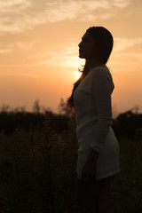 Silhouette of a young asian woman