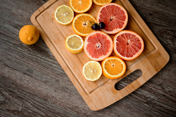Citrus fruit background with sliced oranges as a symbol of healthy nutrition
