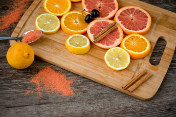 Citrus fruit background with sliced oranges as a symbol of healthy nutrition