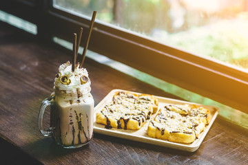 coffee frappe and bread, with creamy tone filter effect