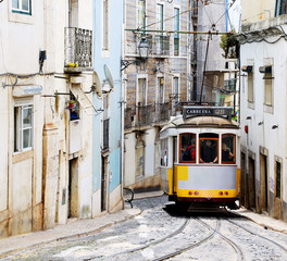 Lisbon, Portugal - 4th May 2017: Famous yellow Tram 28 in Alfama District, Lisbon, Portugal