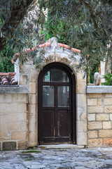 Fototapeta na wymiar Old Wooden Door in Historic Monastery,Monastery of St. Neophyte,Tala Village, Cyprus